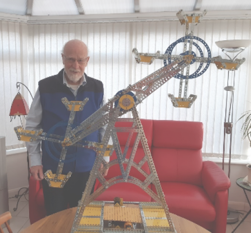 Lion Fred Thompson who achieved 50 years of service with one of his beloved Meccano models