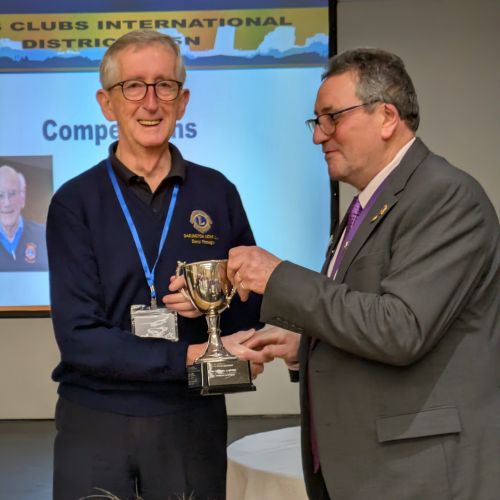 Lion President Denis accepts the Club of the Year Award